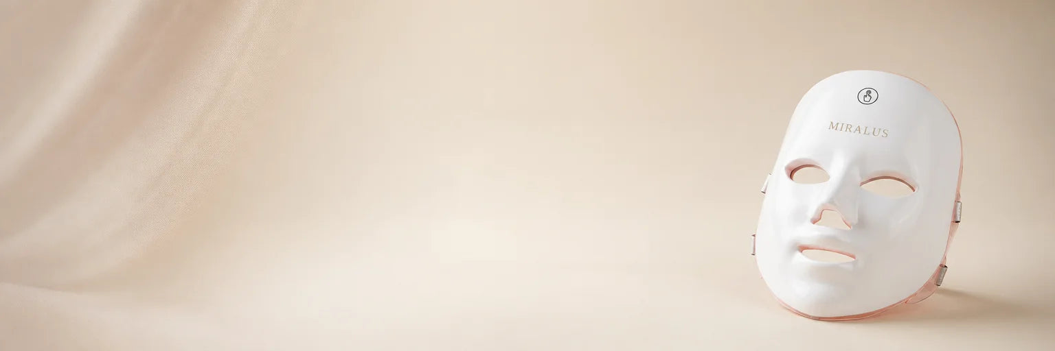 Atmospheric studio banner in a 3:1 cinemascope composition, using the exact MIRALUS LED face mask as